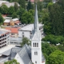 This church was designed by Friedrich von Schmidt in 1905, who also did the city hall and Votive Church in Vienna. Outside there's a small shrine designed by Jože Plečnik.